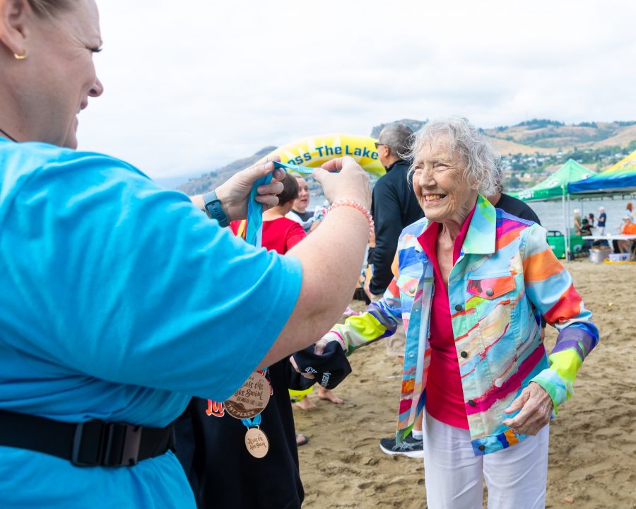 <who>Photo Credit: NowMedia/Gord Goble</who> 92-year-old finisher Conny Stamhuis gets her medal