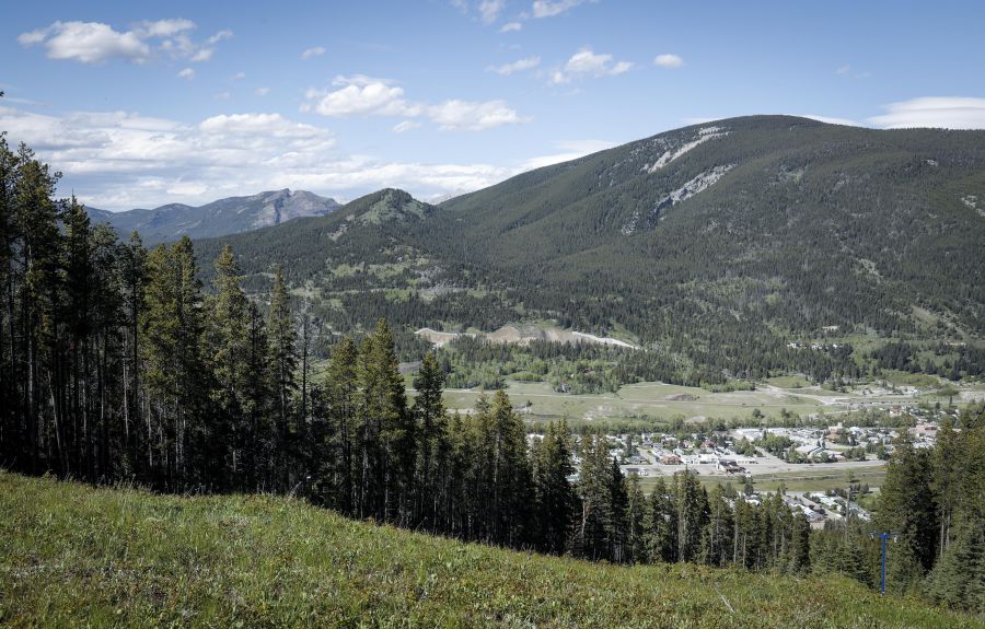 <who> Photo Credit: Canadian Press</who>Grassy Mountain, peak to left, and the Grassy Mountain Coal Project are seen north of Blairmore, Alta., Thursday, June 6, 2024. 