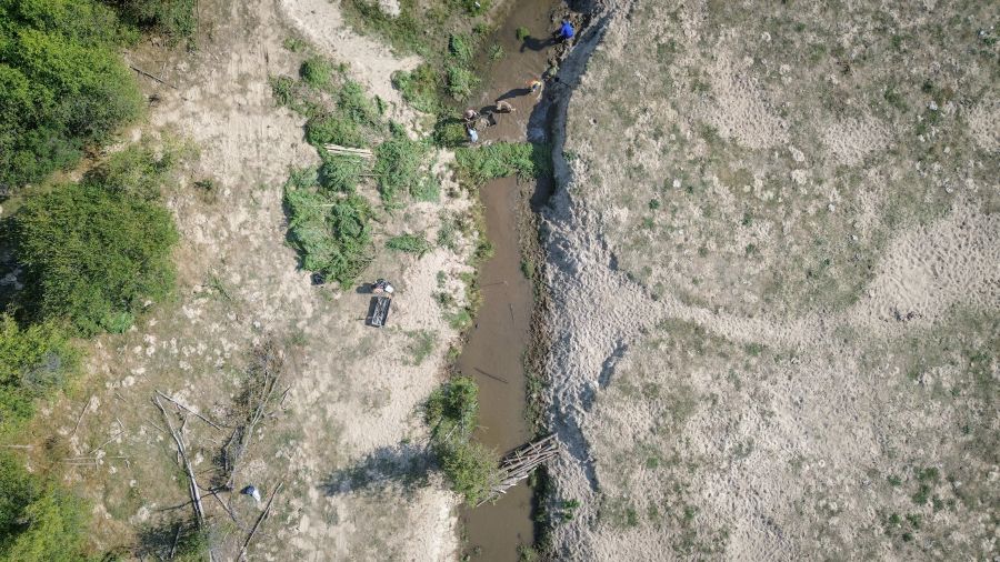 <who> Photo Credit: Aaron Hemens </who> An aerial view looking upstream show crews working along on Coteay Creek on Sept. 10, as they create two beaver dam analogues and two post-assisted-log structures.