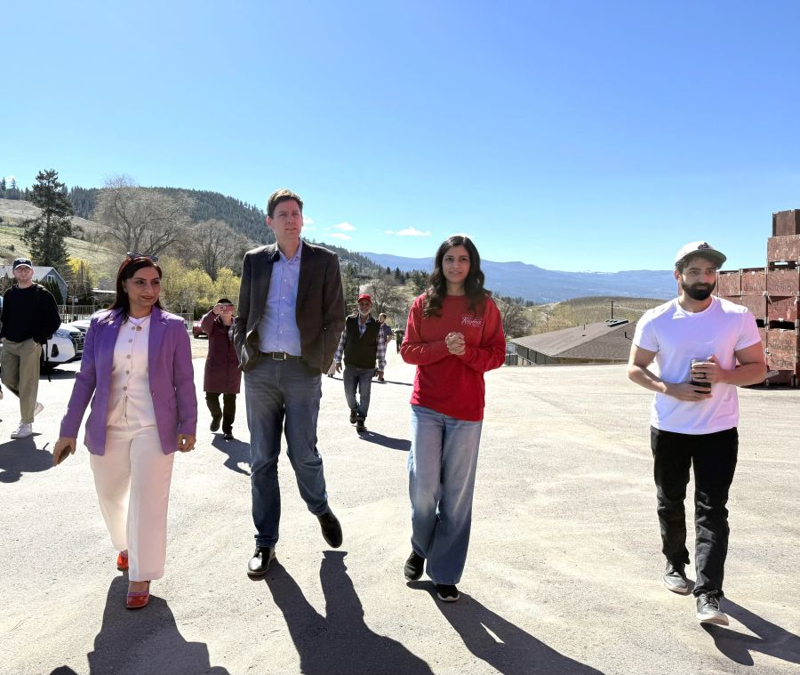 </who>Walking to Farming Karma's production facility. From left, Vernon-Lumby NDP MLA Harwinder Sandhu, NDP Premier David Eby and Karma co-owners Binni Boparai-Gill and Sumett Gill.
