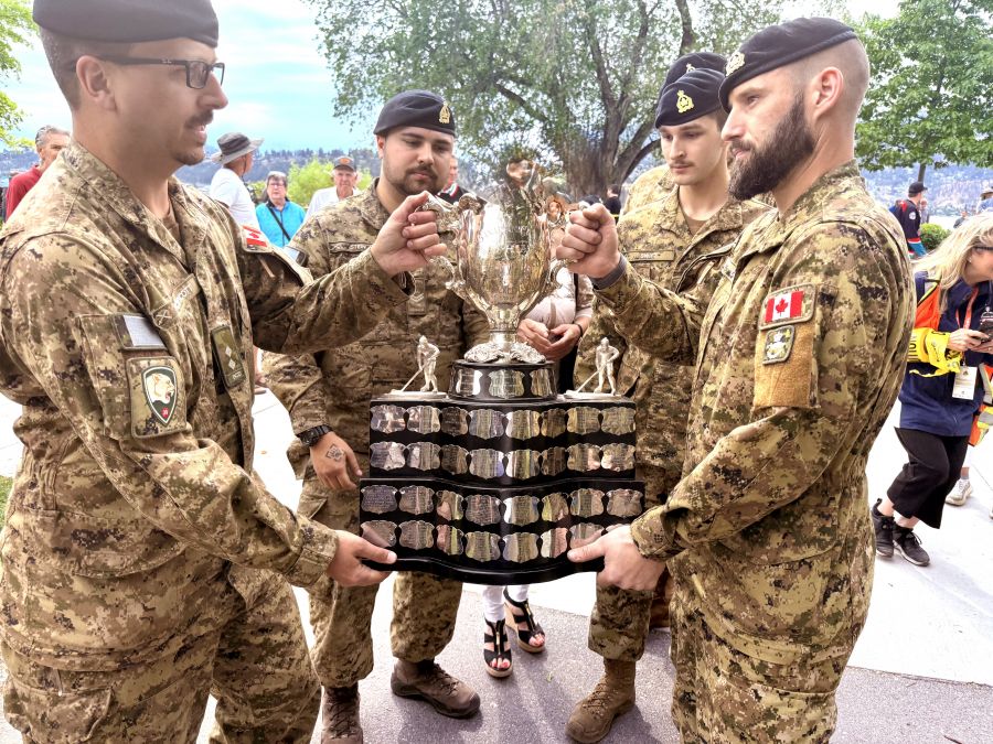 </who>The cup was then handed off to the BC Dragoons of Kelowna and Vernon, above. Below, Squadron Sgt. Major Drew Hillard,