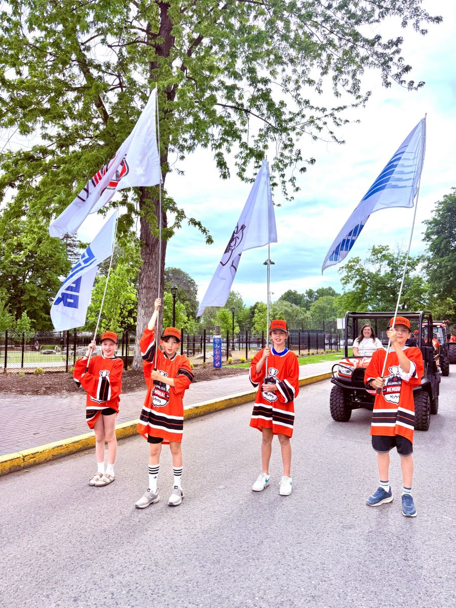 </who>The flag bearers for the parade from City Park to Stuart Park.