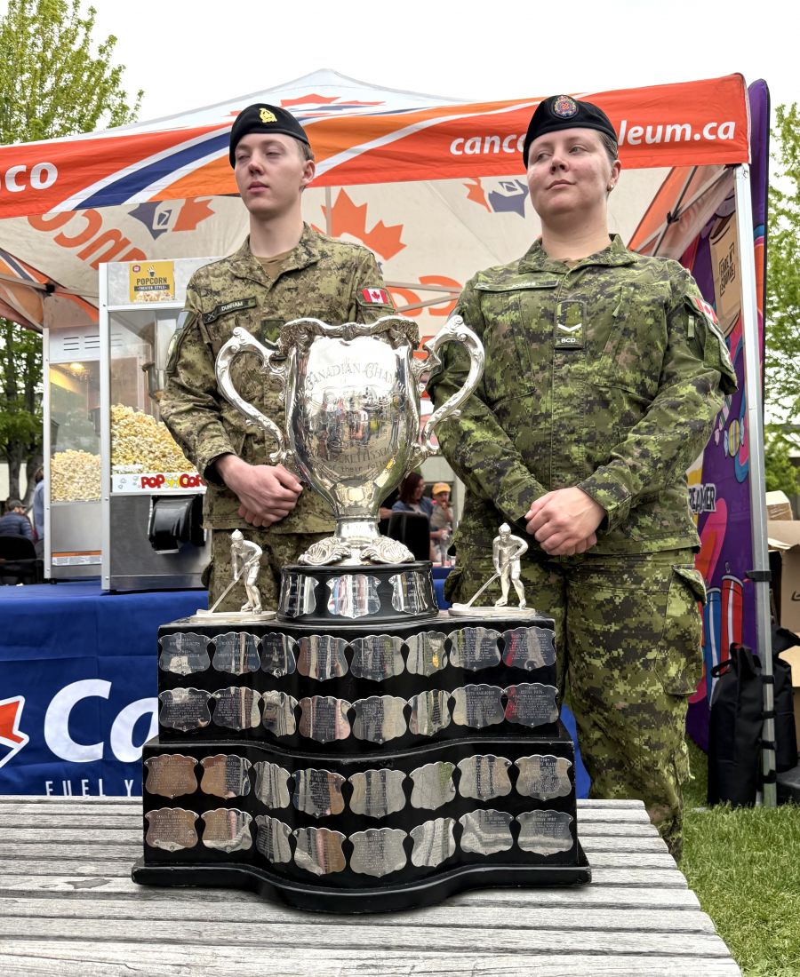 </who>The Memorial Cup waits under BC Dragoons guard for its official introduction at Stuart Park.