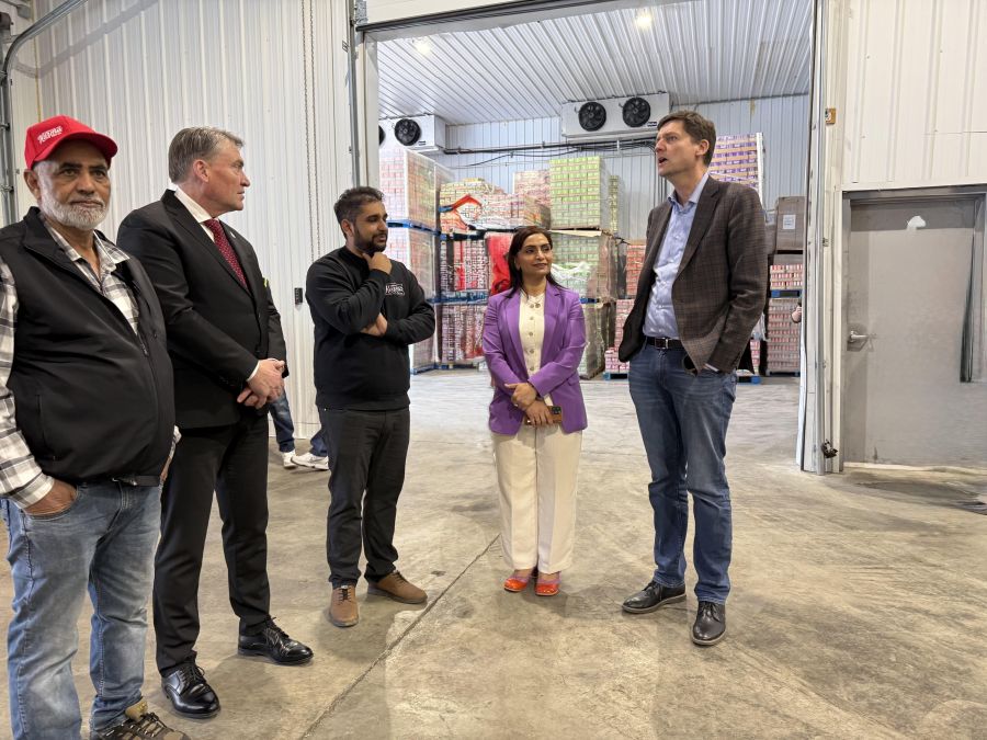 </who> In the production facility. From left, Farming Karma namesake Karma Gill, Kelowna Mayor Tom Dyas, Karma co-owner Abi Gill, Vernon-Lumby MLA Harwinder Sandhu and Premier David Eby.