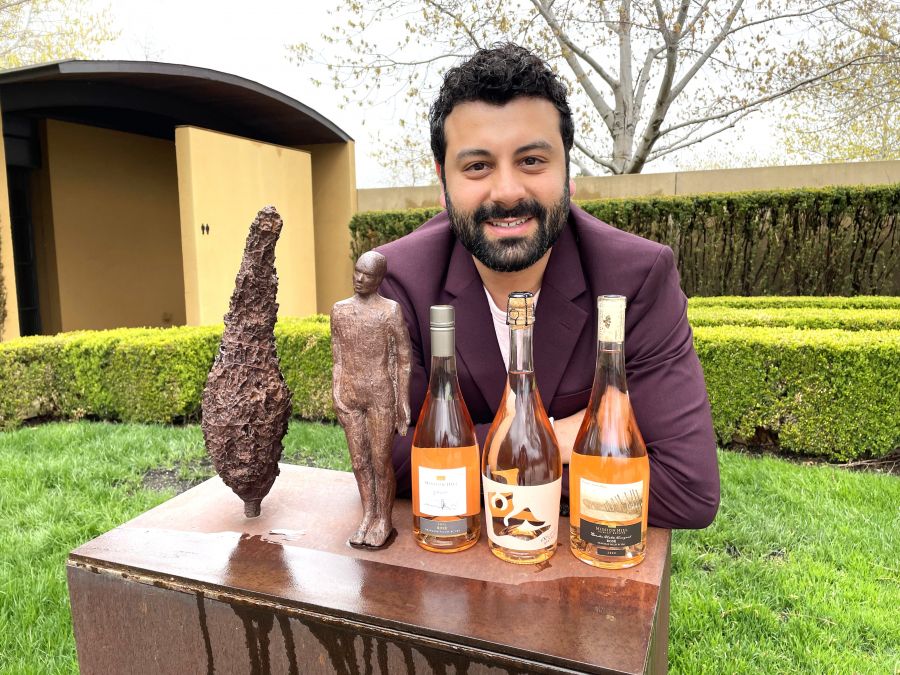 <who>Photo credit: Steve MacNaull/NowMedia Group</who>Showing off the winery's trio of Roses is Mission Hill Family Estate guest experience manager Alfredo Jop.
