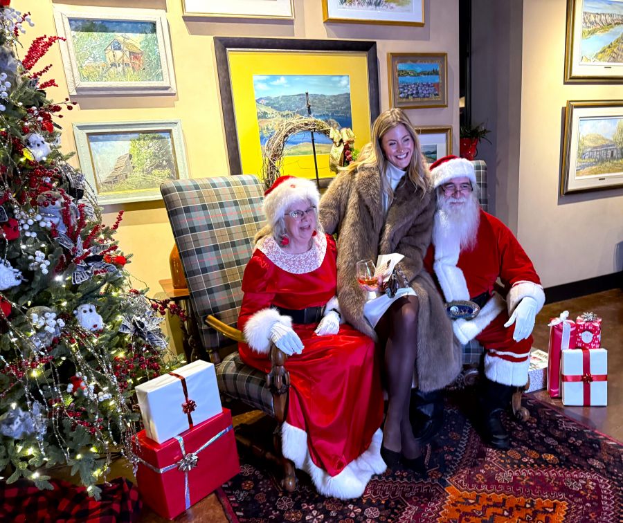 </who>McCall Capozzi visits with Santa and Mrs. Claus, above, at the Festival of Trees kick off at Mission Hill Winery. Below, Upstage Kelowna Show Choir sang in the cellar at Mission Hill's Festival of Trees kick off.