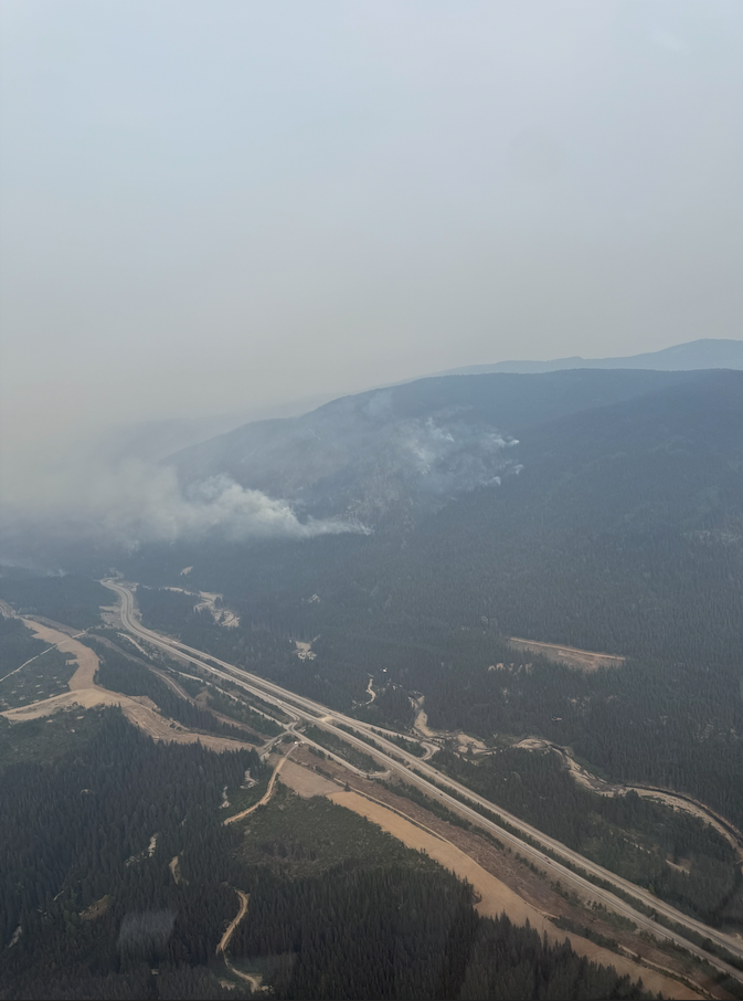 <who> Photo Credit: BCWS</who> Rank 2 fire behaviour along the southeast flank and Hwy 5 Saturday afternoon.