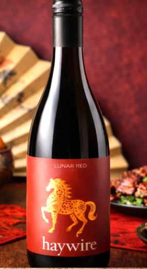 </who>Haywire Winery in Summerland produces a Lunar Red wine, above, every year to mark Chinese New Year. This year's edition has a label, below, featuring a gold horse since it's the 'Year of the Horse' in the Chinese zodiac.