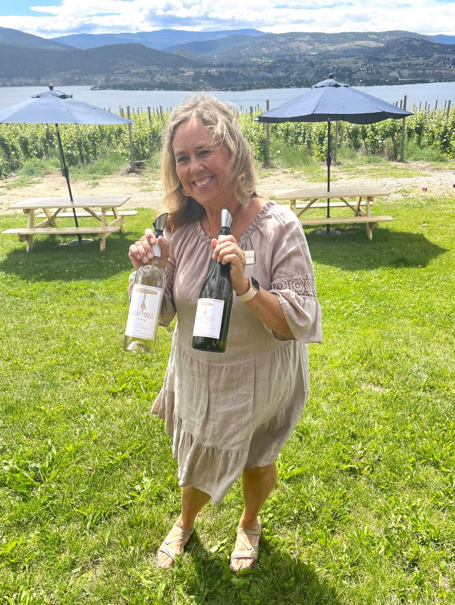 <who>Photo credit: Steve MacNaull/NowMedia Group</who>Shannon from Deep Roots with the 2023 Sauvignon Blanc and 2022 Reserve Chardonnay.