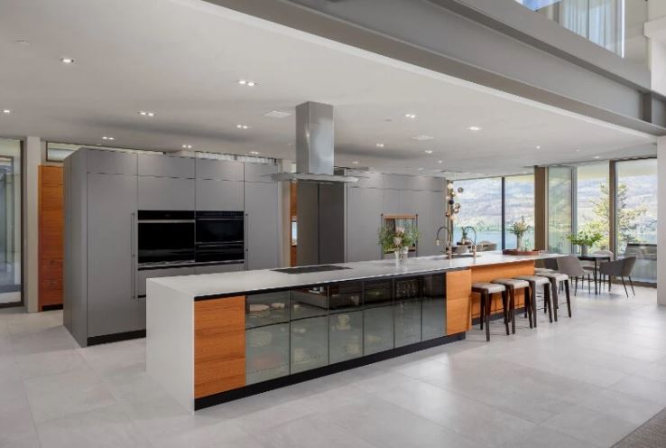 <who>Photo credits: Sotheby's</who>The kitchen, above, is modern minimalist. Below, one of two dining rooms.