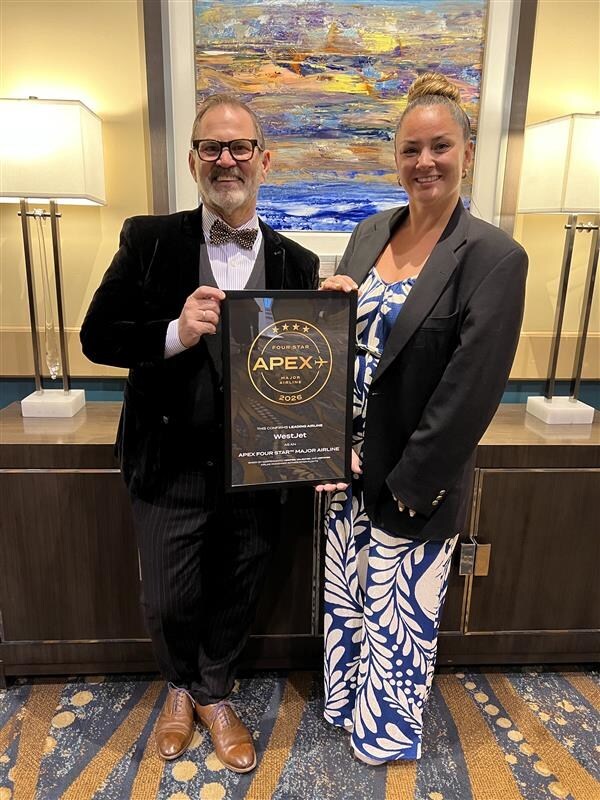 <who>Photo credit: WestJet</who>WestJet inflight vice-president Robert Antoniuk, left, and inflight program manager Daniella Symington picked up the WestJet's Four Star Major Airline Award in Long Beach, California.