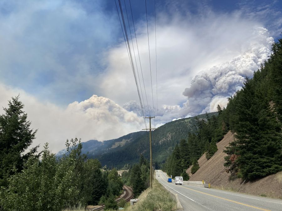 <who>Photo Credit: BC Wildfire Service</who>A view of the Ainslie Creek wildfire's plume of smoke on Tuesday afternoon before Highway 1 was shut down.