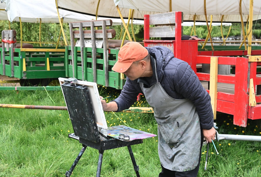 <who> Photo credit: LJI </who> Painting trees that form triangles is pleasing because the triangle is the strongest, sturdiest shape, says Men in Hats member Frank Fan.