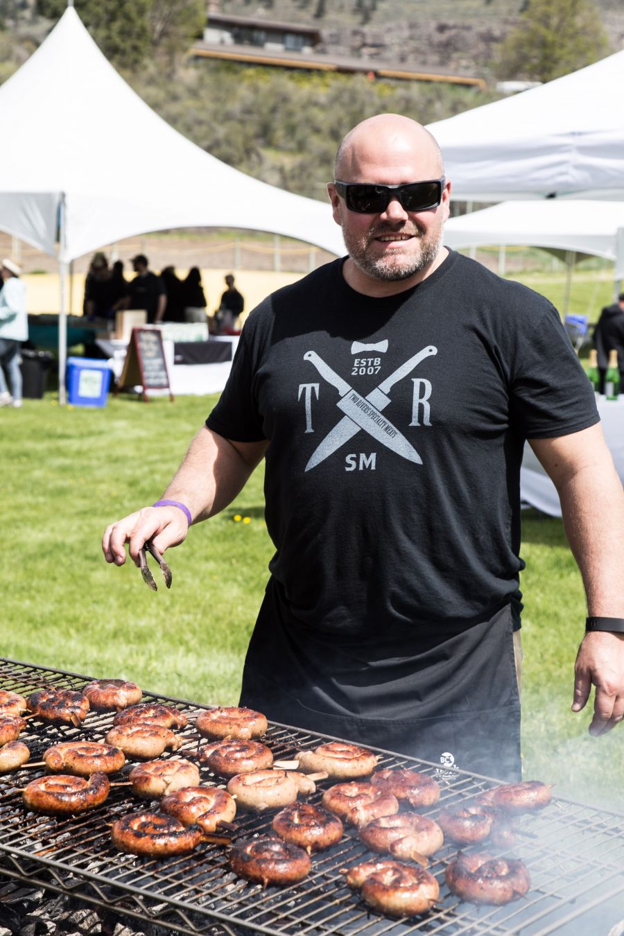 </who>Grilling sausages at Pig Out.