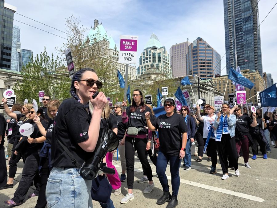 <who>Photo Credit: Local Journalism Initiative</who>Over 550 BCNU nurses and allied health-care workers rally in downtown Vancouver on April 30, 2026.