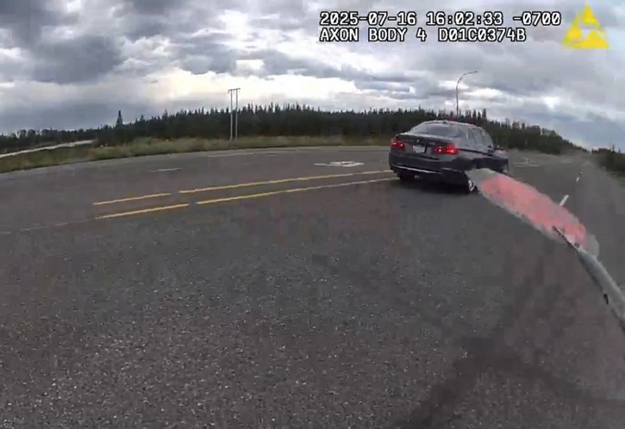 <who>Photo Credit: BC Highway Patrol</who>Police body-camera still image showing the backside of the BMW after it passed a high-visibility police officer on Hwy 97.
