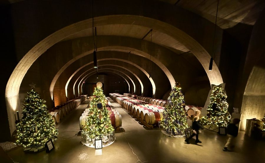 <who>Photo credits: Steve MacNaull/NowMedia Group</who>There are Christmas trees throughout Mission Hill Winery, including the barrel cellar.