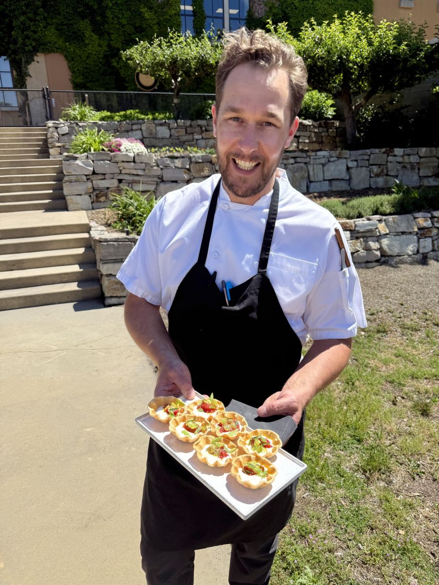 <who>Photo credits: Steve MacNaull/NowMedia Group</who>Mission Hill Family Estate executive chef Patrick Gayler with mascarpone and goat cheese tarts in the estate garden.