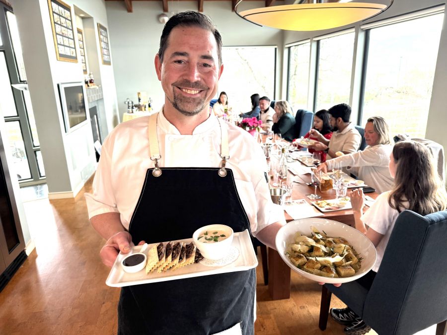 </who> Blasted Church chef John Burke holding the feta dip and the gnocchi.