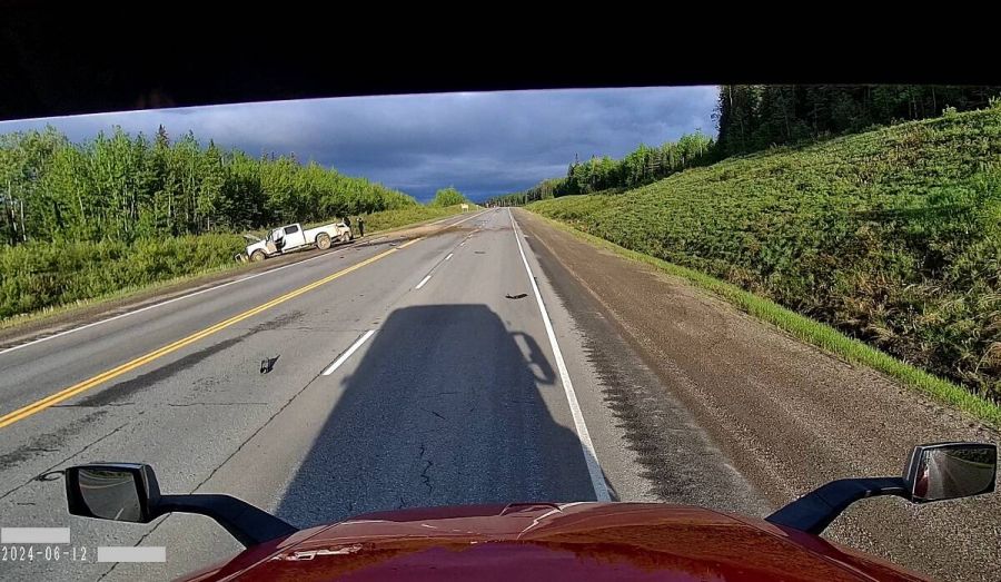 <who>Photo Credit: BC Highway Patrol</who>The two pickups at the side of the road following the fatal crash.