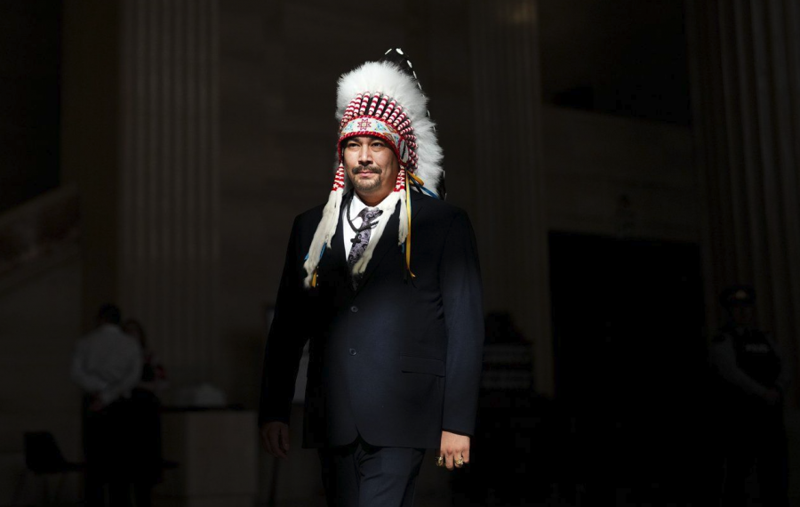 <who> Photo credit: Canadian Press </who> Lake St. Martin First Nation Chief Christopher Traverse walks through the lobby of the Supreme Court of Canada in Ottawa on Monday, Oct. 23, 2023.