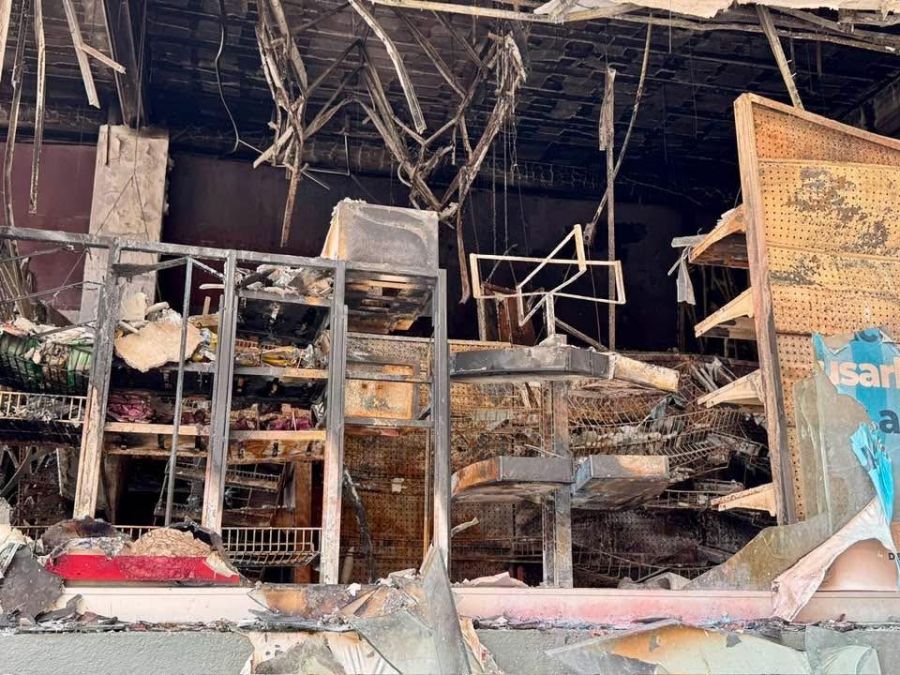 </who>Above, building facade gone. Below, another facade gone.