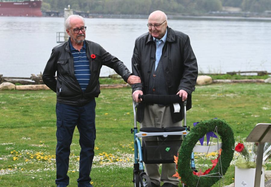 <who> Photo credit: Abby Luciano, Local Journalism Initiative Reporter </who> David Cormier comforts Bob Reid during a ceremony to mark the 60th anniversary of a plane crash that Reid survived while five other crew members died.