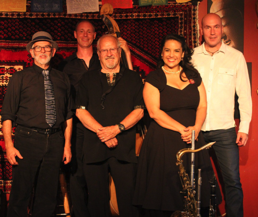 <who> Photo credit: Keith Lacey, Local Journalism Initiative Reporter </who> Special to Okanagan Newspaper Group The Crawford/Crossley Group is pictured at the conclusion of a recent performance at The Dream Cafe in this file photo.