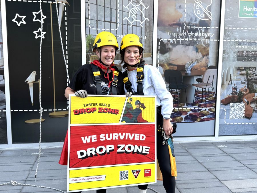 </who>Joanna Penich and Braelyn Bjornson celebrate post-rappel.