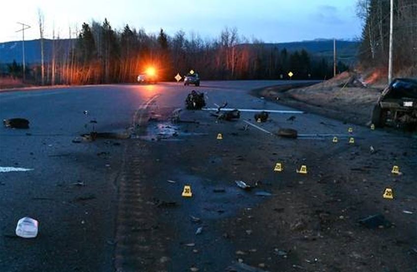 <who>Photo Credit: BC Highway Patrol</who>Cones, debris and emergency vehicles at the scene of a double-fatal crash on Hwy 97 near Chetwynd on April 7, 2024.