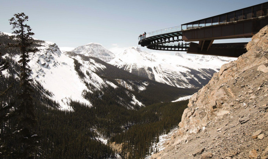 <who> Photo credit: Canadian Press </who> Tourists take in the views from the newly opened Glacier SkyWalk near the Columbia Icefields in Jasper National Park, Alta.