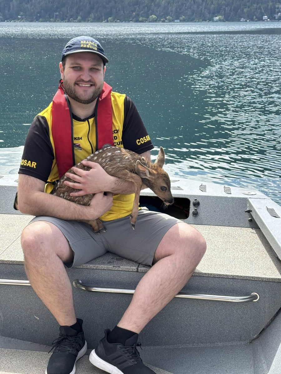 <who>Photo Credit: COSAR</who>Mitch LaRue holds his adorable new friend.