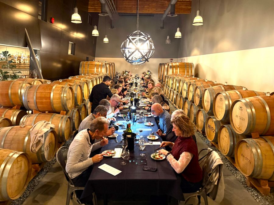 <who>Photo credit: Steve MacNaull/NowMedia Group</who>The long table in the barrel room at Kelowna's Sandhill Winery for the 'Taste of Italy' dinner.