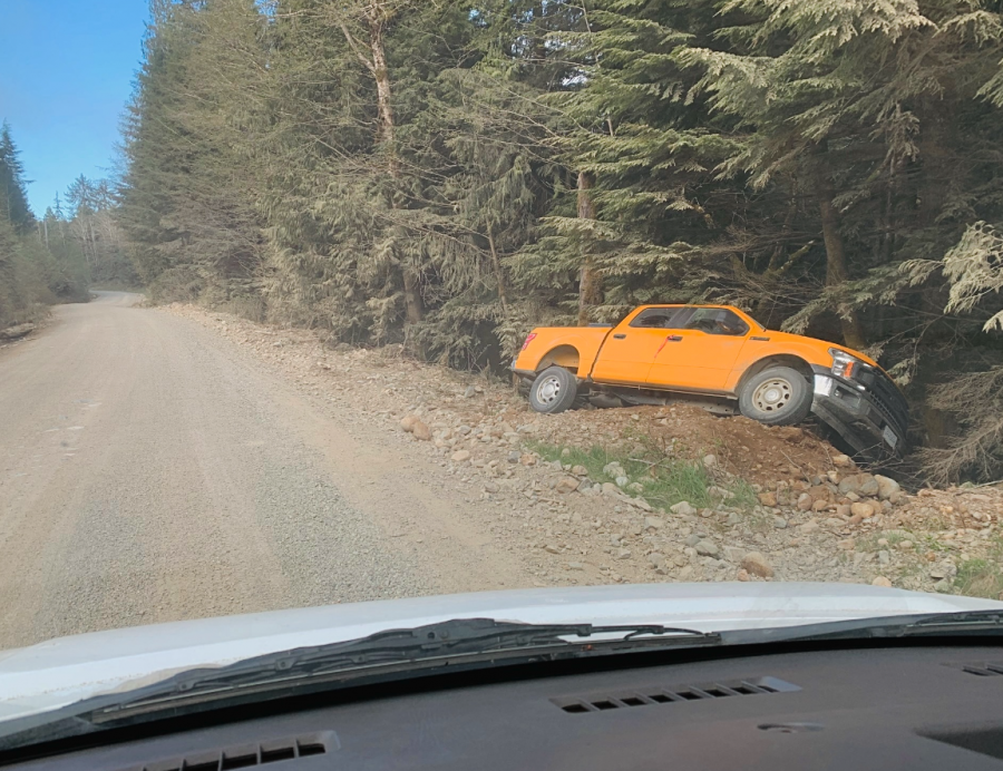 <who> Photo credit: LJI </who> Orange pickup truck that went off a gravel forest road and into an embankment last week.
