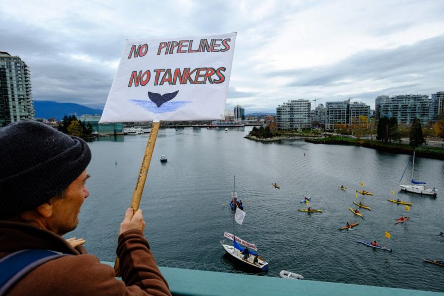 <who>Photo Credit: David Niddrie / Flickr (CC BY-NC 2.0)</who>Thousands of protesters marched in Vancouver on Nov. 19, 2016, opposing Kinder Morgan's expansion of the Trans Mountain Bitumen pipeline project with a terminus in the Burrard Inlet at Burnaby, BC.