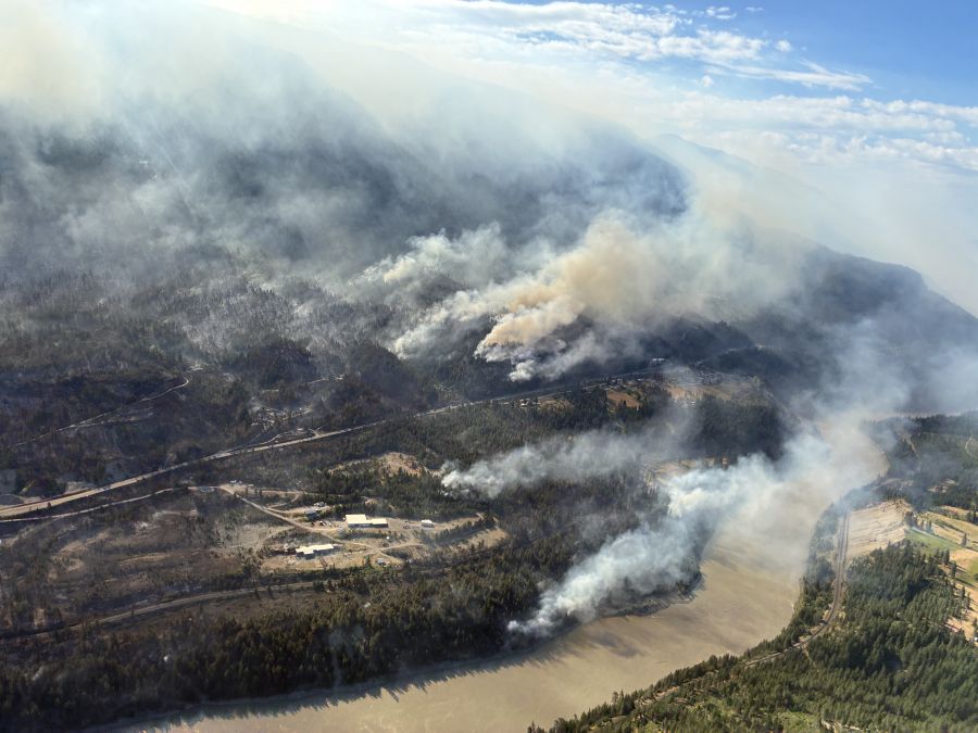 <who>Photo Credit: BC Wildfire Service</who>A look from the northwest shows Hwy 1 and the Fraser River, where the fire has reached but not crossed.