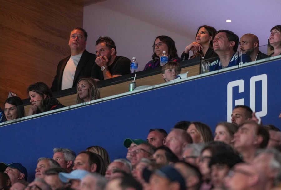 <who>Photo Credit: Canadian Press</who>Alberta Premier Danielle Smith, front second left, and B.C. Premier David Eby, front right, watch the Vancouver Canucks and Edmonton Oilers play Game 2 of an NHL hockey Stanley Cup second-round playoff series in Vancouver on May 10, 2024.