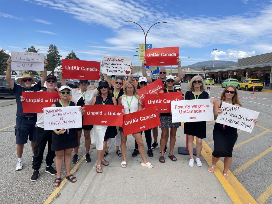 </who>A dozen flight attendants were protesting this afternoon.