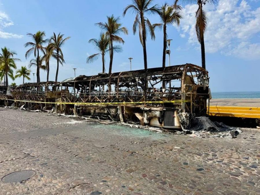 <who>Photo credits: Brenda Bachmann</who>Three burned out buses along the Malecon.