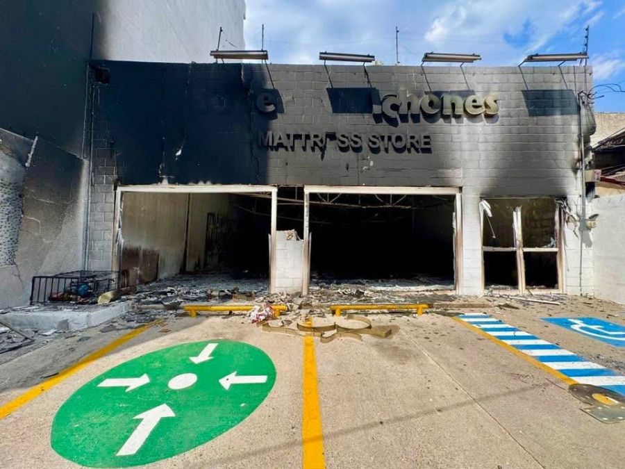 </who>Above, a torched mattress store. Below, a torched OXXO convenience store in bottom of an apartment building.