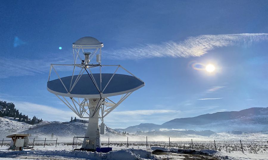 <who>Photo Credit: Luca Galler</who>The DRAO 15m telescope at work scanning the sky for the DRAGONS survey. The data collected by this survey is a new generation of radio surveys that allow scientists to continue mapping the Milky Way and its three-dimensional magnetic field structure.