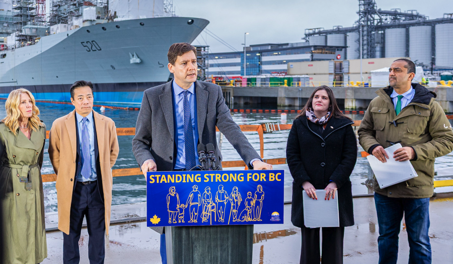 <who> Photo credit: Government of BC </who> Premier Eby (centre) making the announcement on Monday.