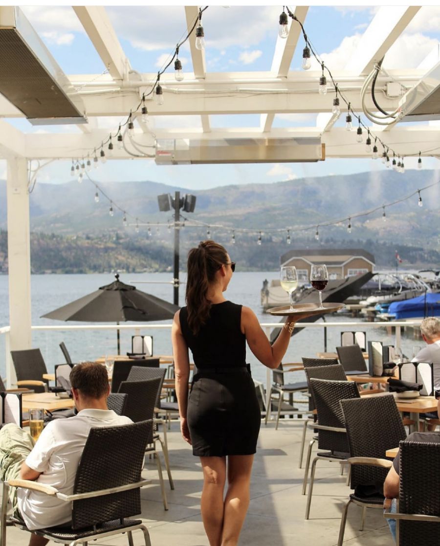 </who>A waitress makes her way to the outdoor lounge seating at the Hotel Eldorado.