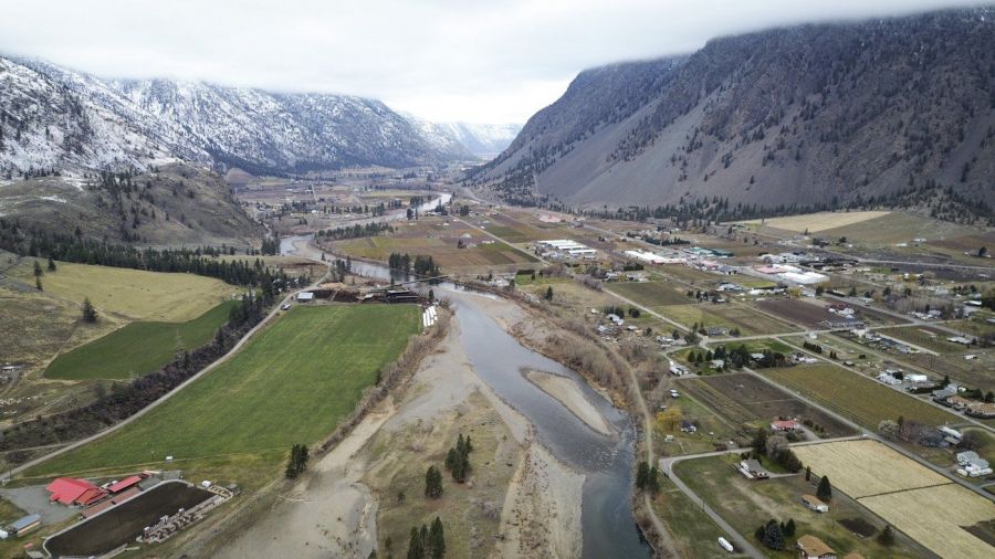 <who>Photo Credit: Aaron Hemens</who>nməlqytkʷ (The Similkameen River) flowing through the Town of Keremeos in smǝlqmíx homelands in 2024.