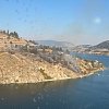 Firefighters bring Okanagan Lake wildfire under control with air tankers, helicopters