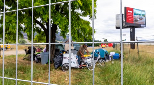 Fences, guards surround subdued Fairview encampment