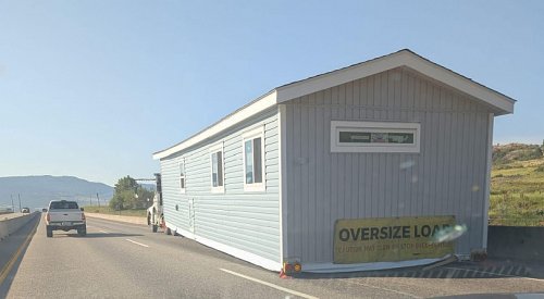 UPDATE: Hwy 97 fully open near Kelowna airport after house cleared from road